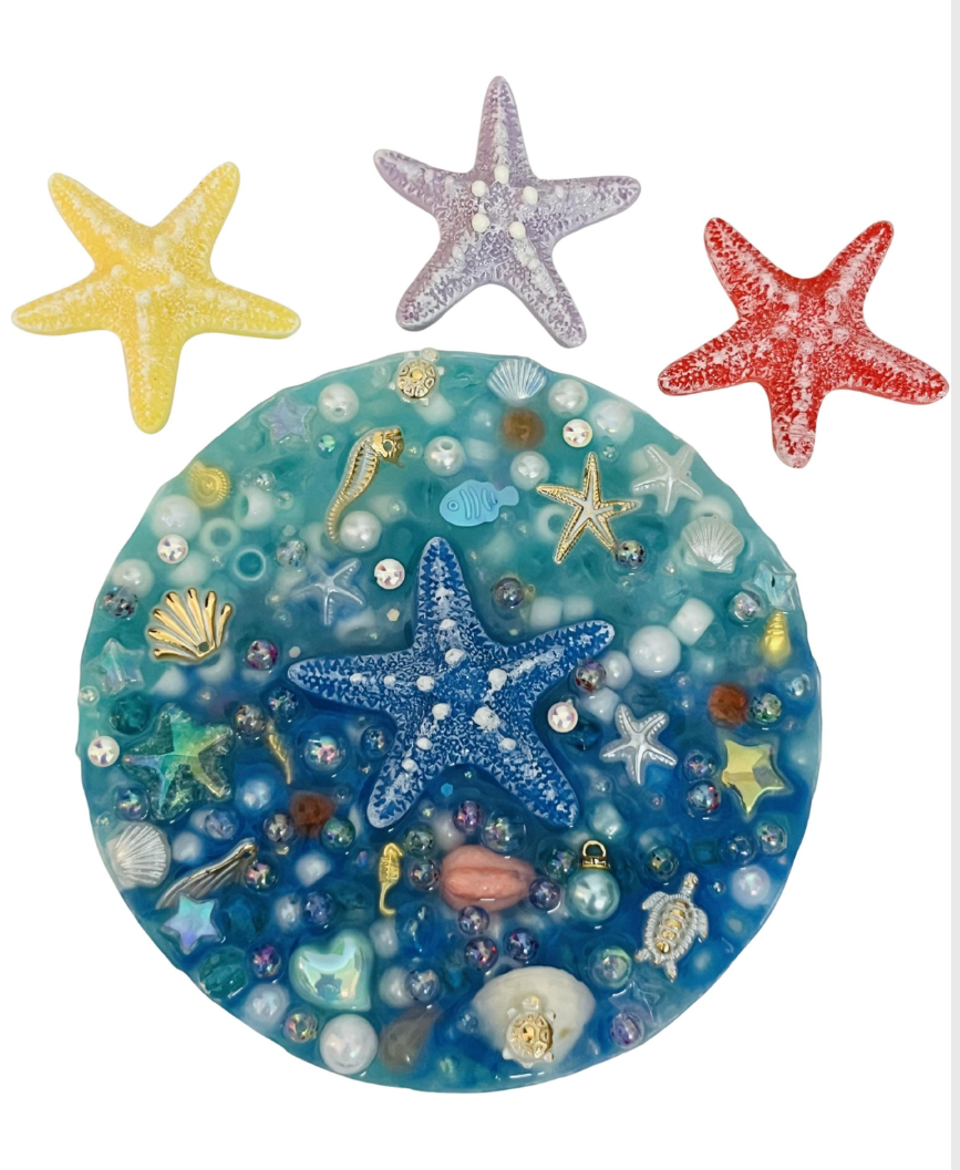 Decorative ocean-themed resin piece with stars on a smartphone screen